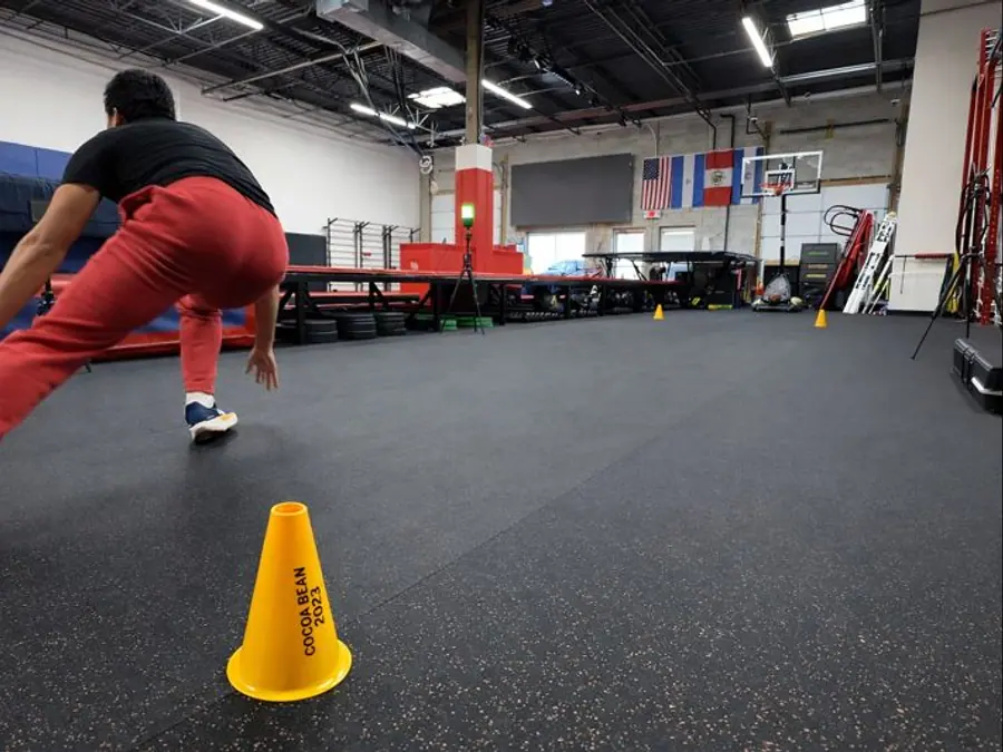 Athlete completing a cone agility drill at Vortex